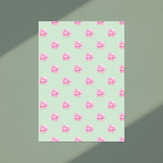 Notebook with watercolour pink floral pattern on a light green cover